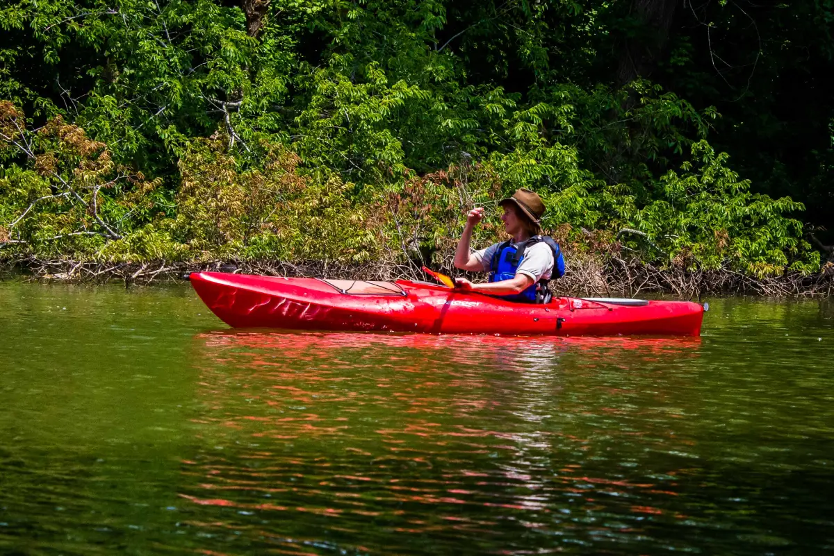 Paddler on Kentucky Lake, boat ramp scene, or quiet shoreline reflection
