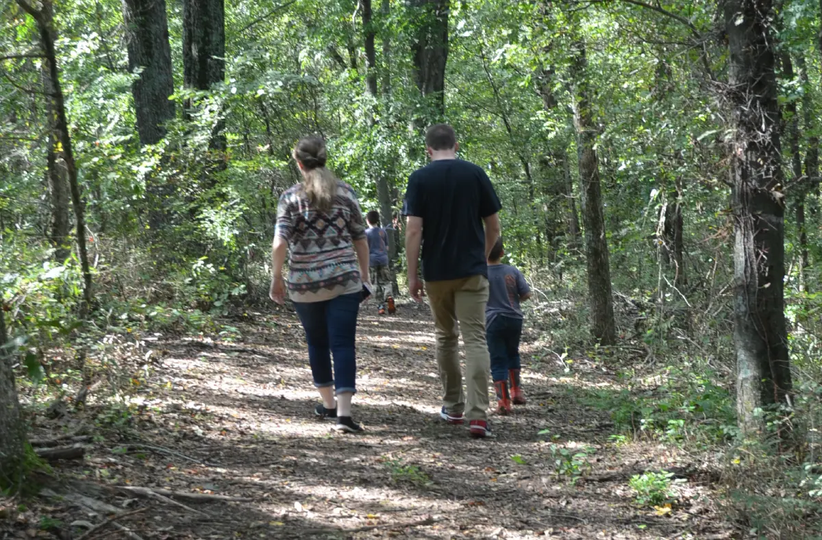 Grandparent and child walking at the refuge
